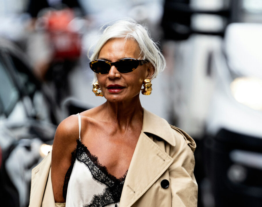 older woman standing in street
