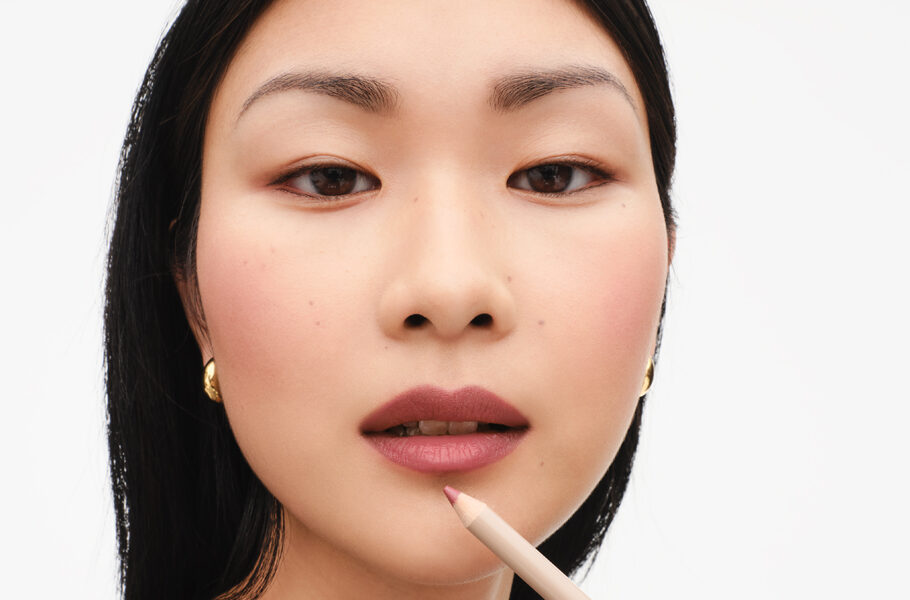 woman applying lip liner