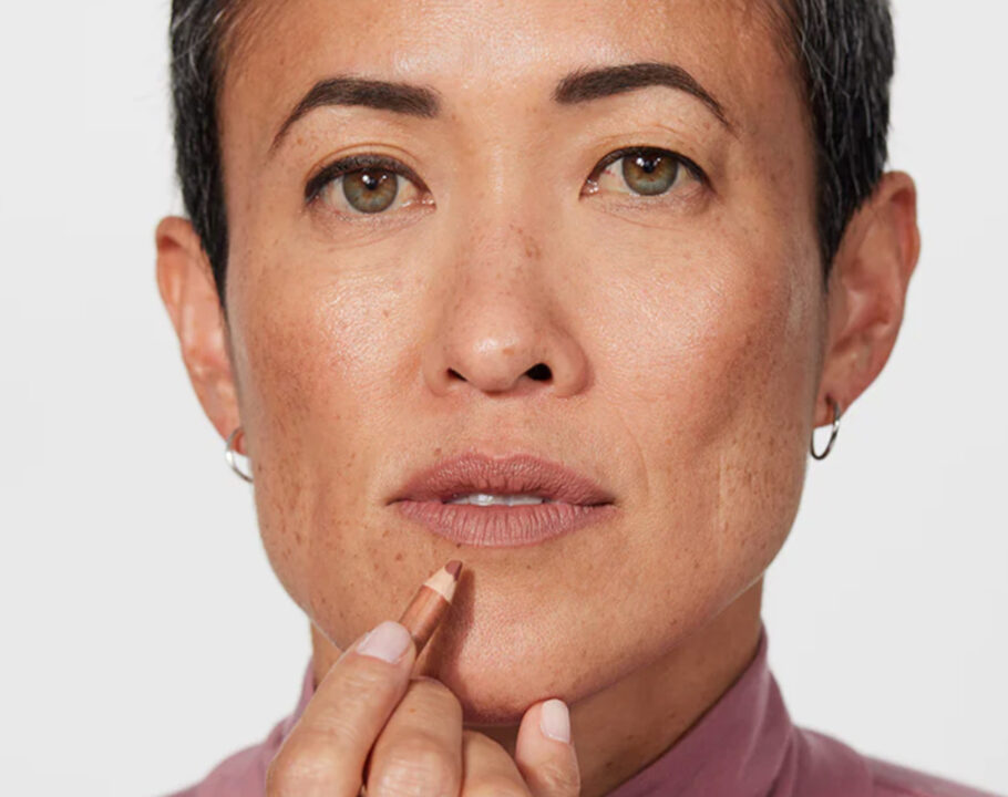 woman applying jones road lip liner